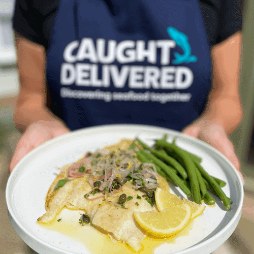 Grilled fish with lemon and green beans served