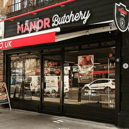The Manor Butchery shopfront with red awning